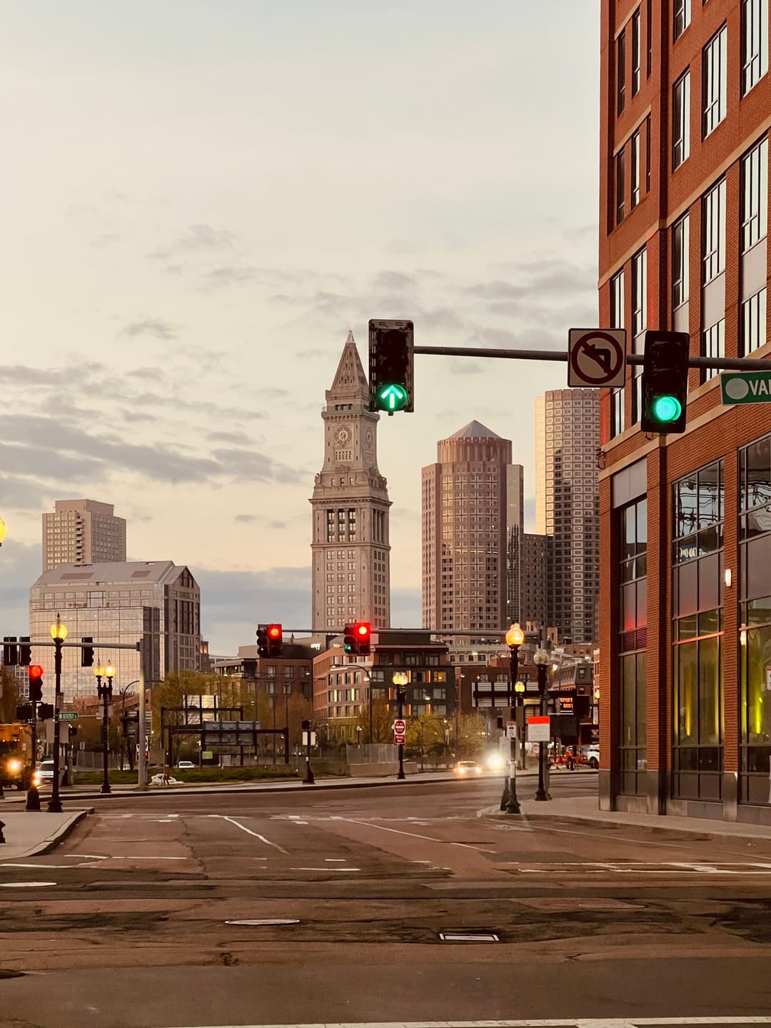 The Custom House Tower rising over downtown Boston at dusk.