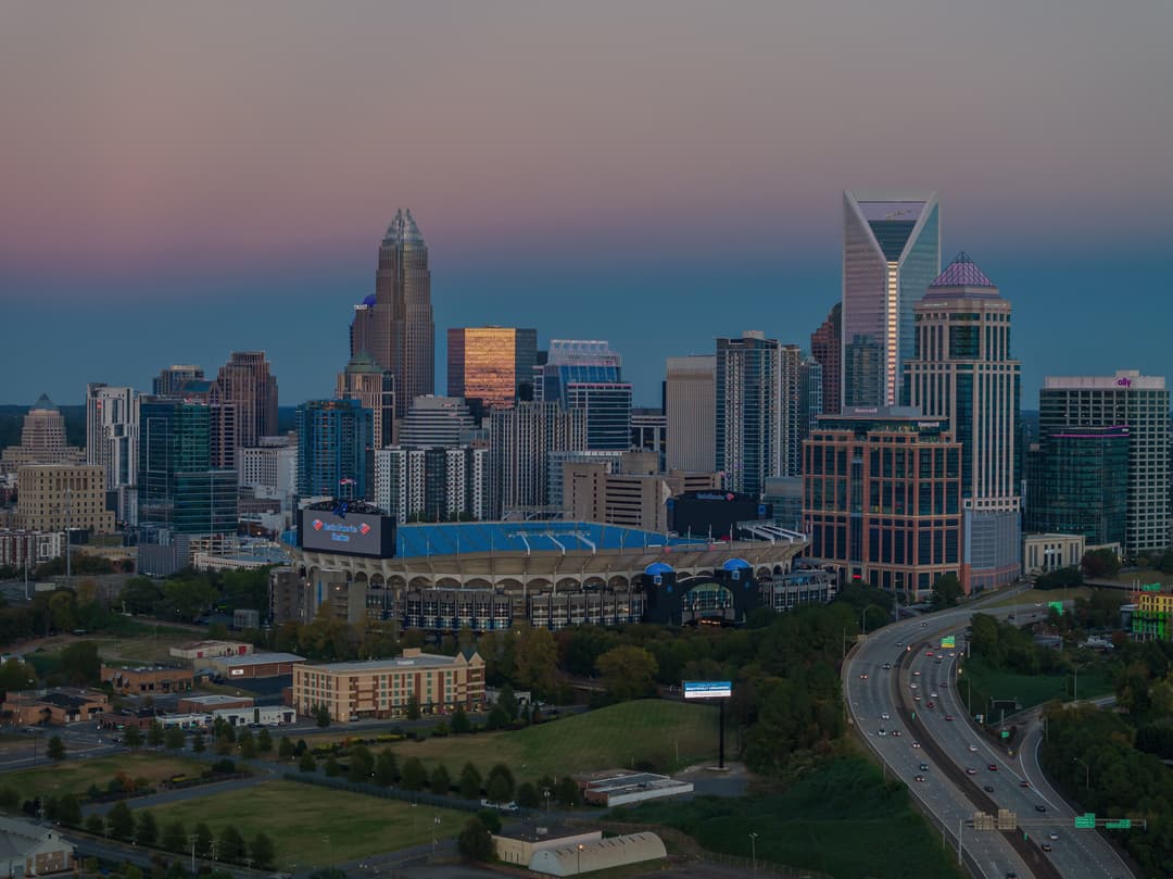 Charlotte's Uptown skyline behind Bank of America Stadium.