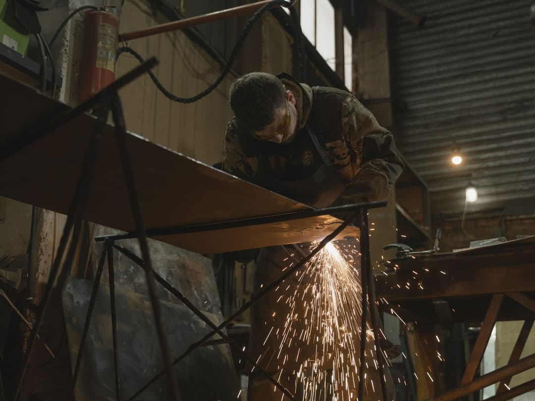A day spent bent under the hood, where the trade finds the neck, shoulder, and elbow every shift.