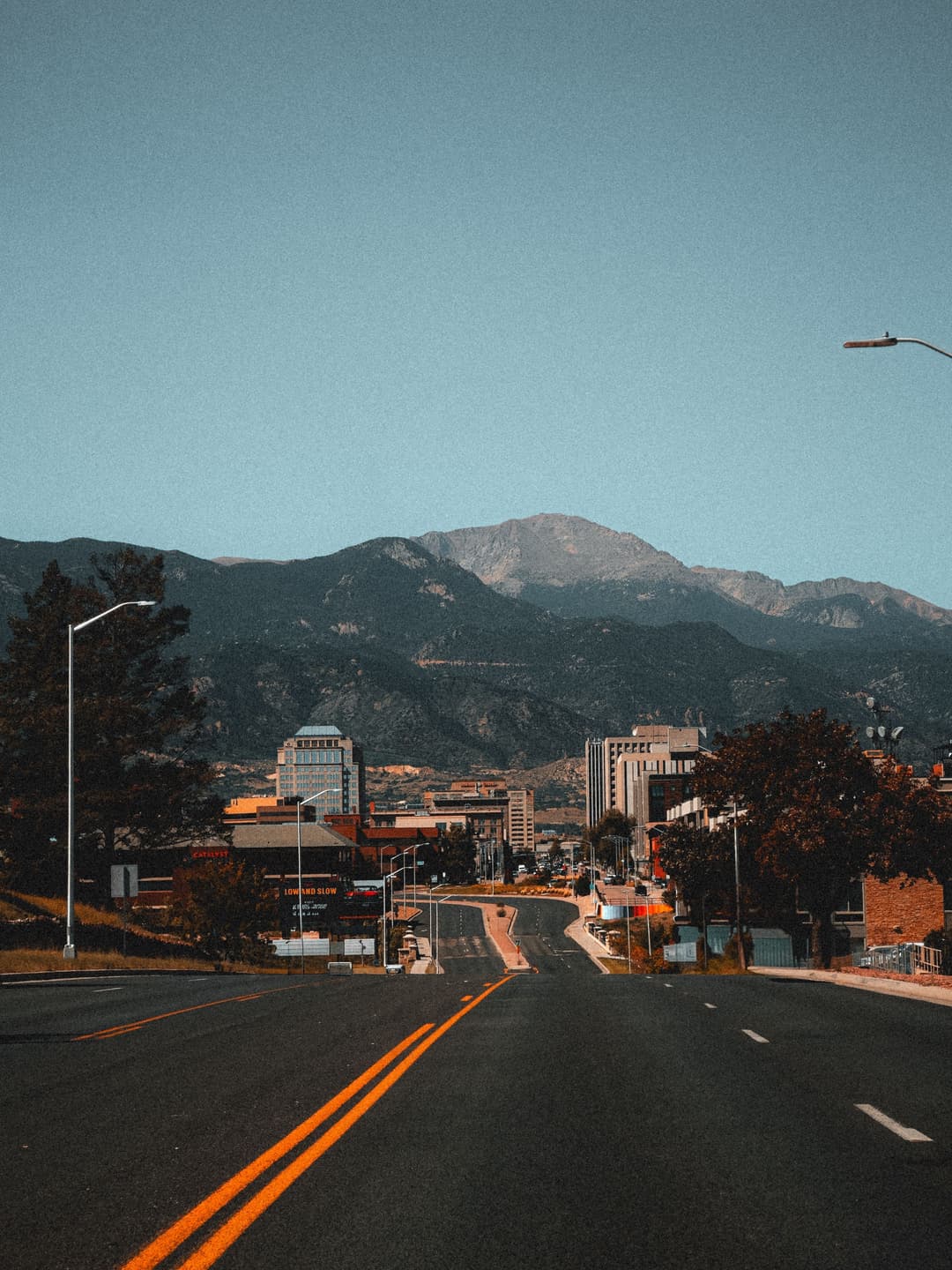Downtown Colorado Springs with Pikes Peak rising to the west.