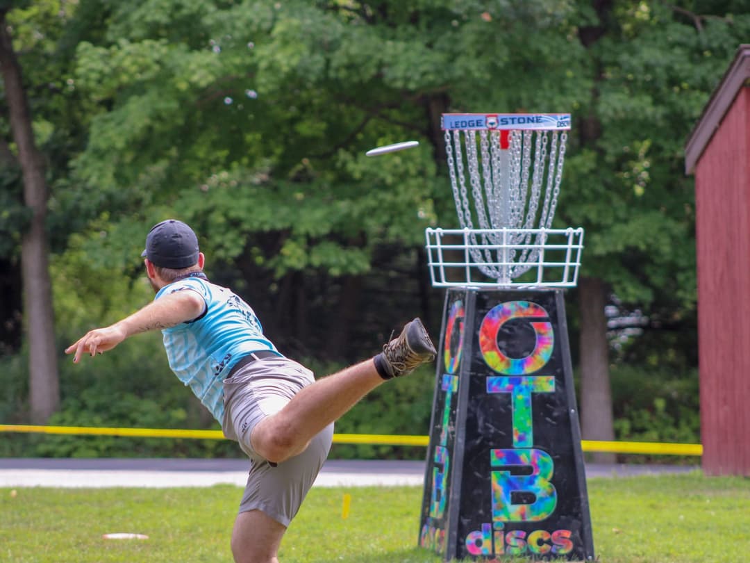 The forehand release at full torque, where a disc golf round finds the elbow, shoulder, and wrist.