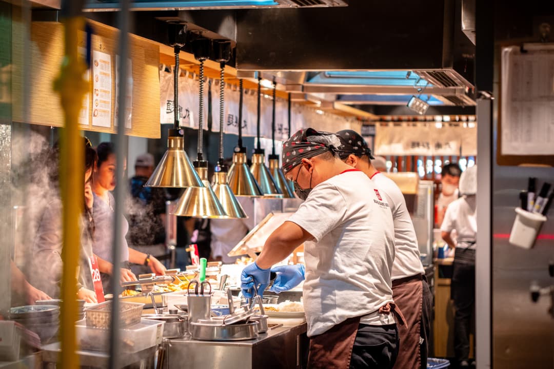Ten-plus hours on hard kitchen floors, high-volume knife work, and the close-then-prep cycle each land on a specific part of a cook, and each has a named fix.