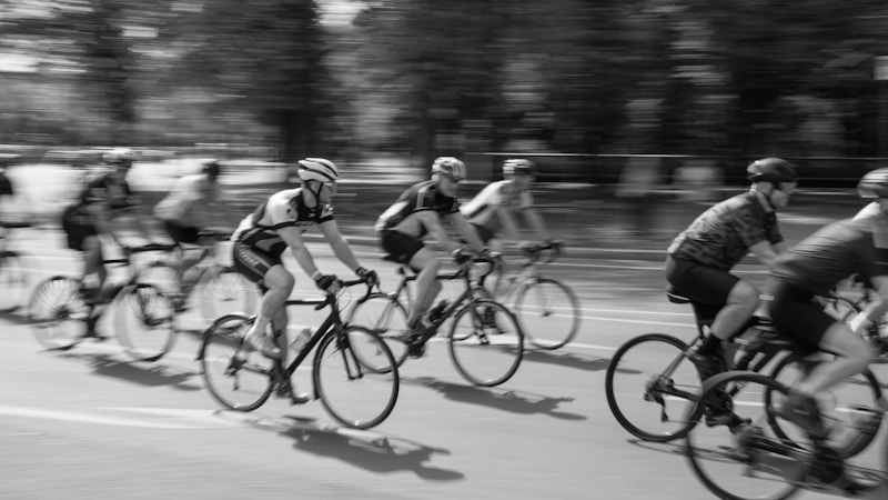 Cyclists riding together on an open road